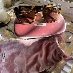 Miu Miu Tortoise shell sunglasses.